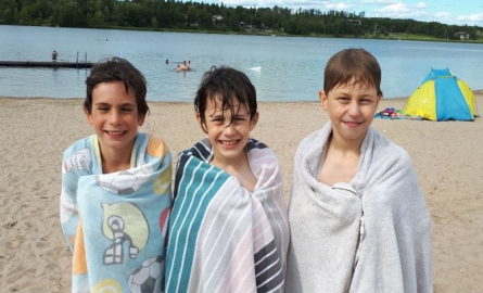 three young boys at the beach